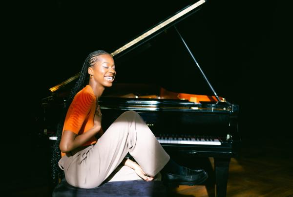 A female musician sat at the piano. 