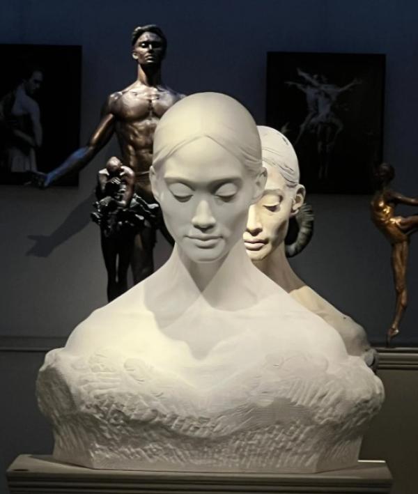 Fumi by Andrian Melka, a female bust made from marble, with eyes cast downwards