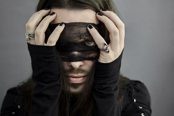 Headshot of David Lawrie of The Royal Ritual, posing in gothic attire