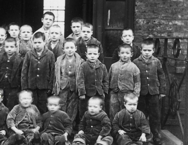 A black and white photo of children at a Victorian workhouse