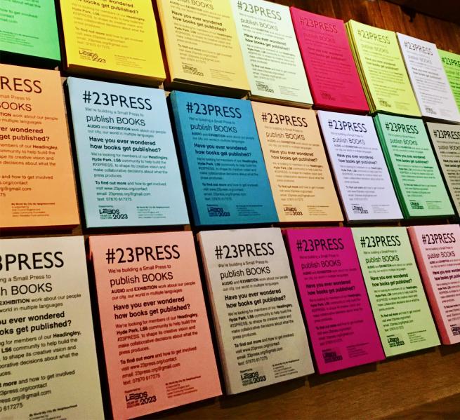 Lots of coloured flyers on a table