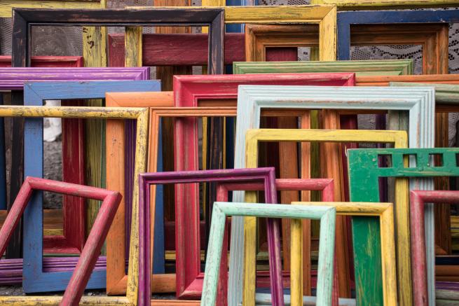 Lots of colourful picture frames 