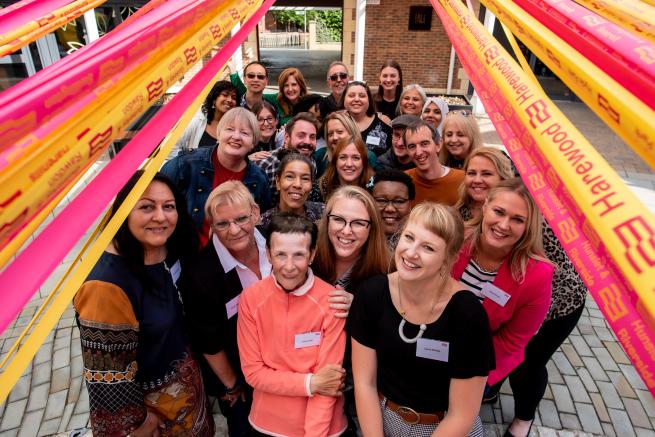 a group of people smiling at the camera