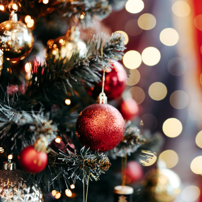 A Christmas tree with baubles and twinkly lights