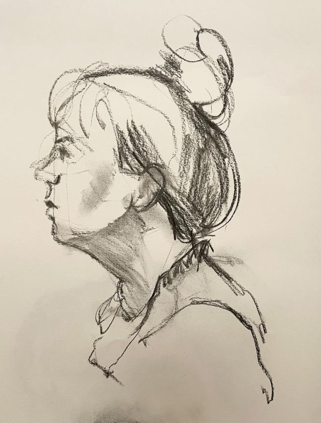 A side profile charcoal drawing of a woman