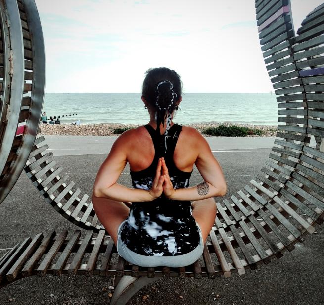 Yoga pose palms in prayer behind the back