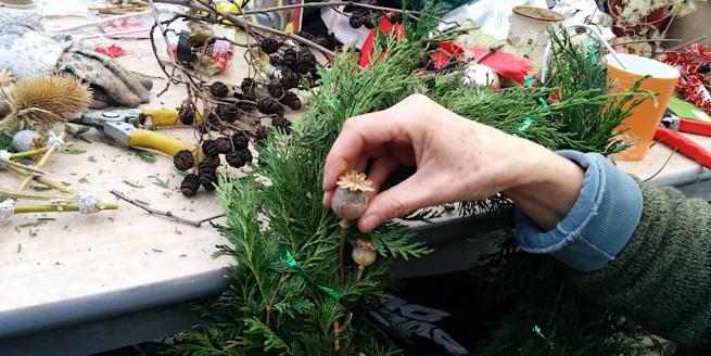 Seasonal wreath being constructed