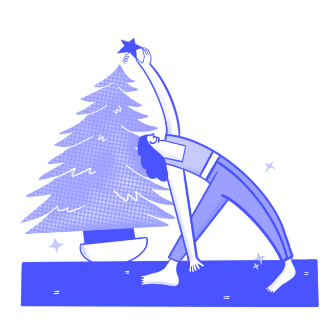 A yogi stretches whilst placing a star atop a Christmas Tree