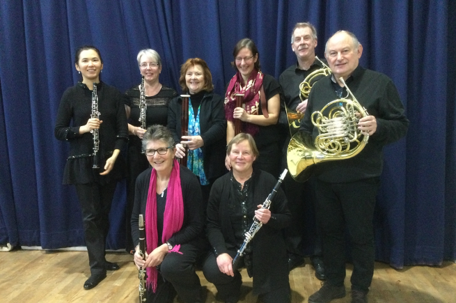 The members of Wind Power posing with their instruments.