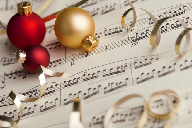 A picture of Christmas baubles and sheet music
