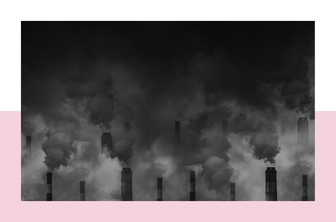 A black and white photo capturing smoke billowing out of chimneys, evoking a sense of exploration in an industrial world.