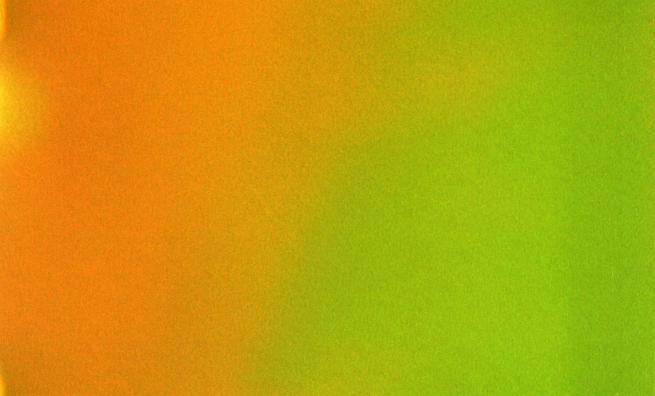 A horizontal gradient from a warm orange to a lime green heavy with film grain.