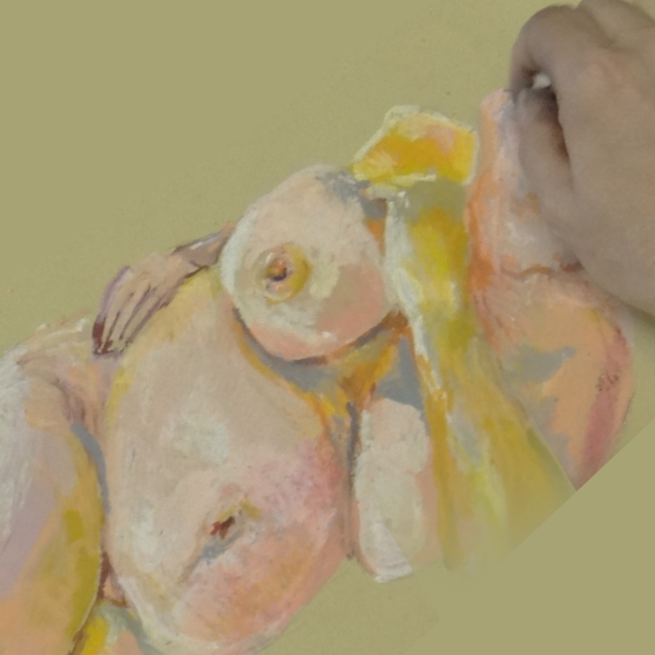 A hand finishing a sketch of a nude woman in pink and yellow pastels on yellow paper