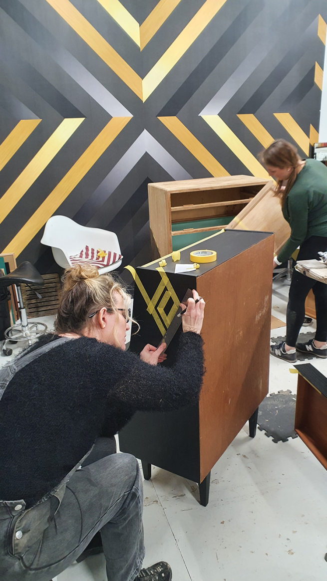 People working on vintage furniture on a Done up North Furniture Upcycling workshop 