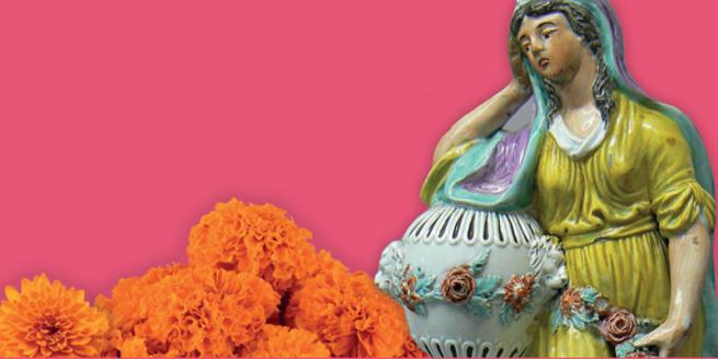 A statue of a woman leaning on an urn with marigolds surrounding her, on a pink background.
