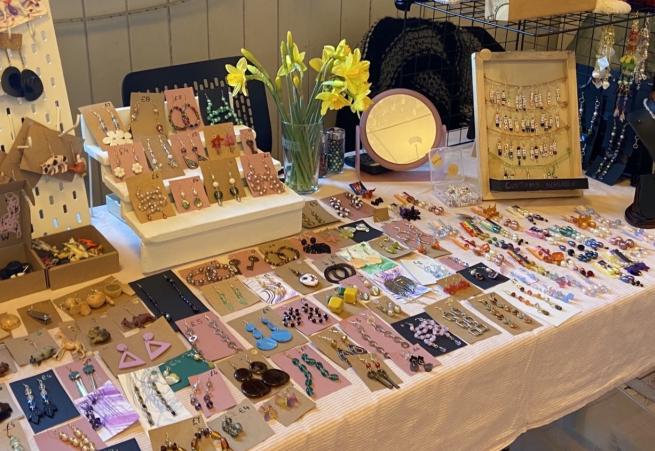 A stall from one of our makers at the last Springboard market, with a variety of earrings and handmade items.