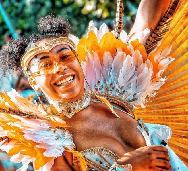 a dancer from the carnival in gold and silver costume