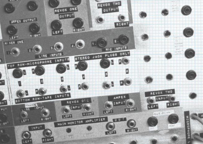 Close up black and white photograph of plug sockets on the back of an amp