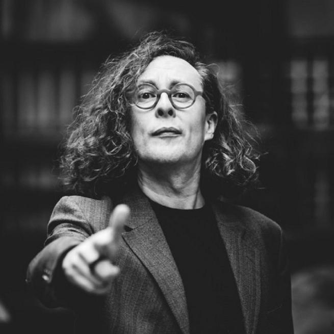 Black and white portrait of Miles pointing