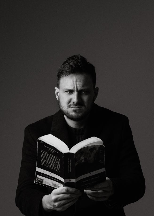 Mike Rice reading a book