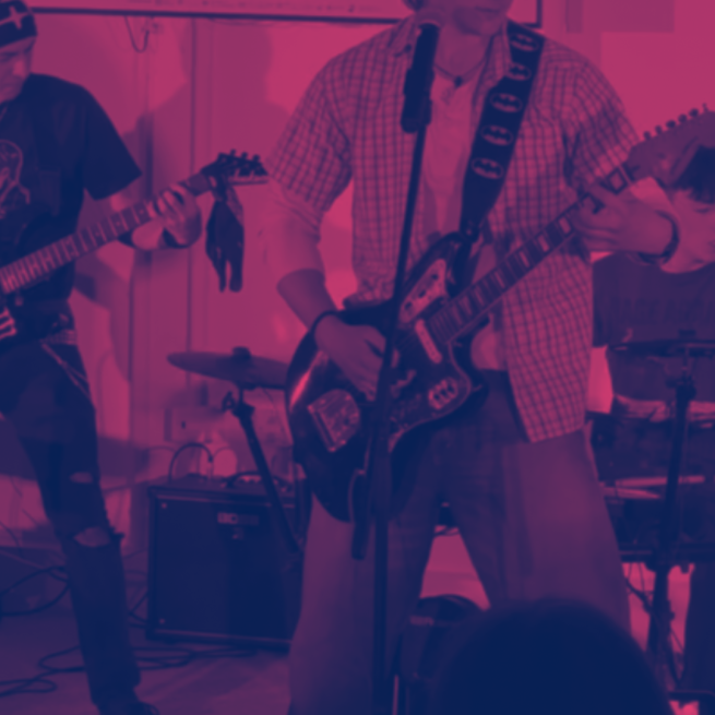A youth band playing guitars 