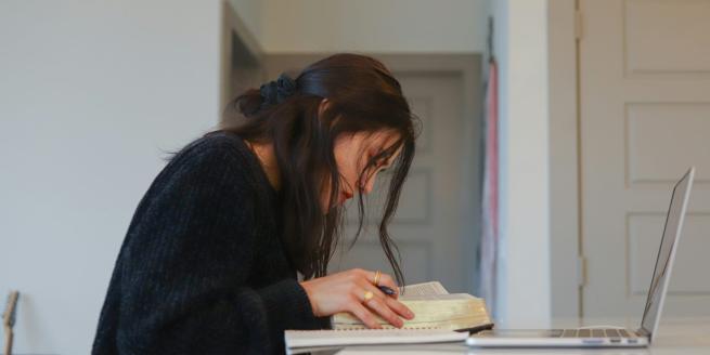 a woman looking at a book