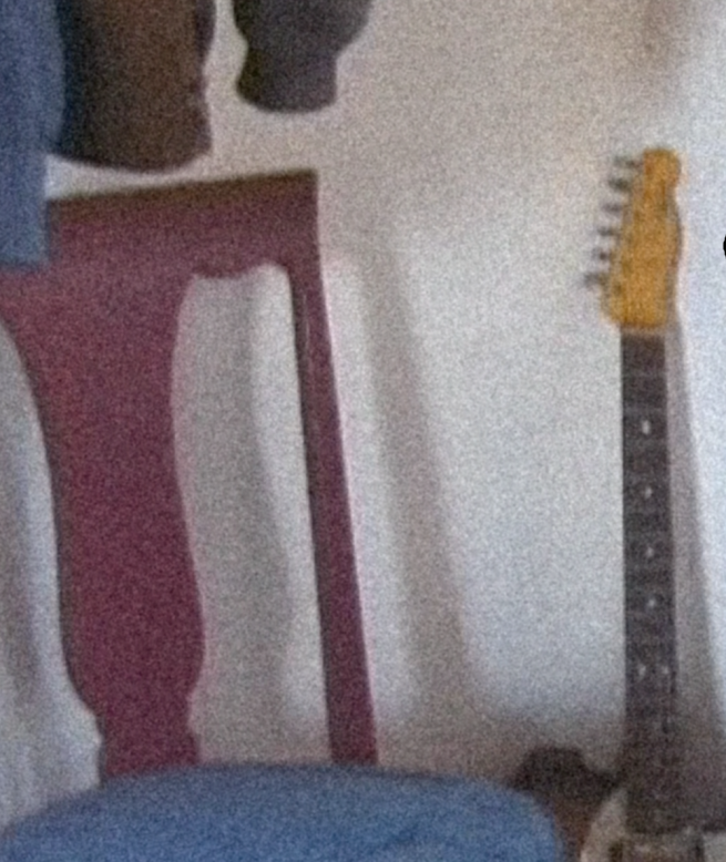 a chair and guitar neck