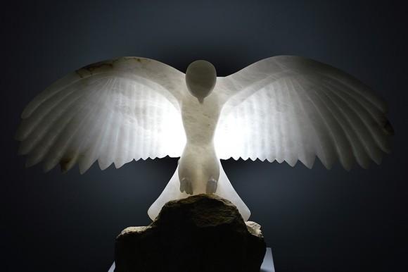 A snow-white bird sculpted in alabaster