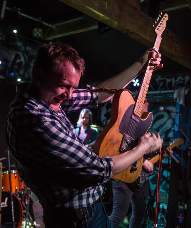 Lead singer Darren Driver playing his signature Fender Telecaster guitar.  
