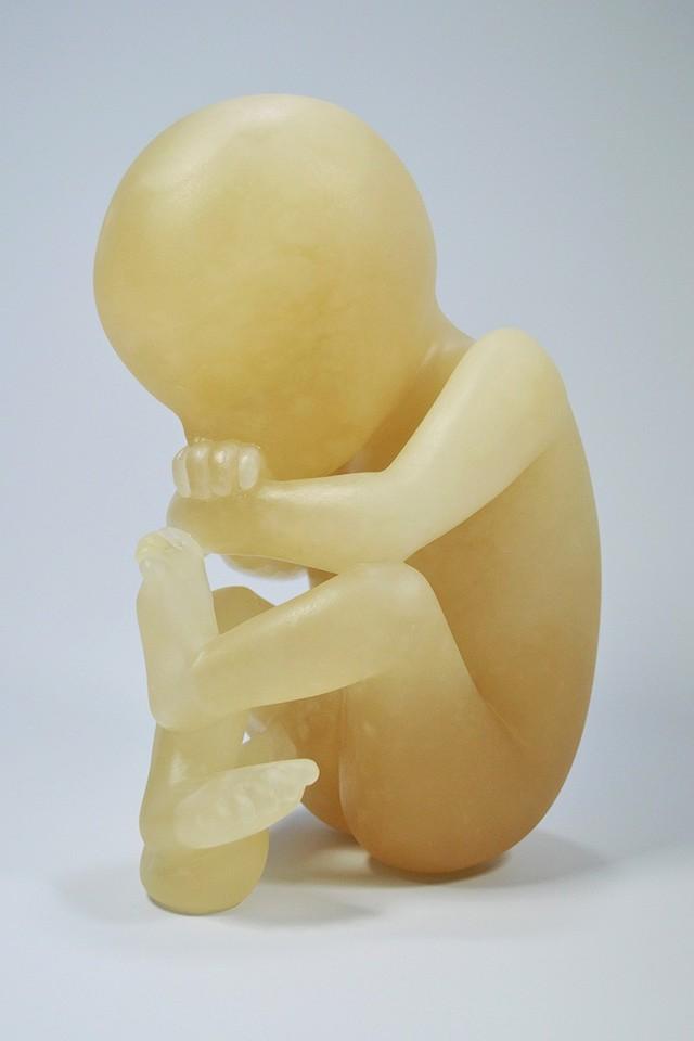Foetus carved in champagne alabaster