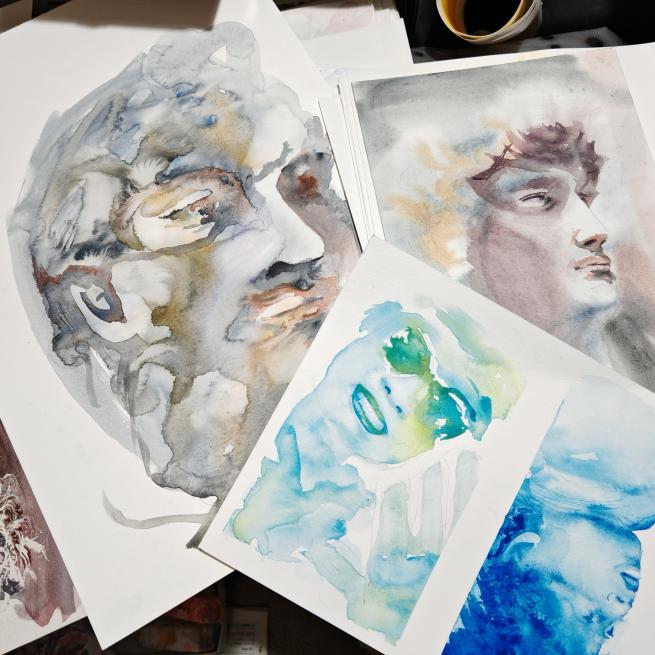 4 watercolour paintings depicting faces.