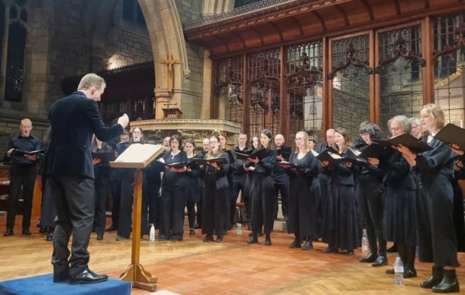 A choir performing a concert in a church