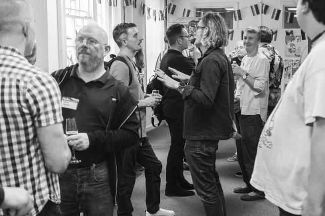 Photograph of people socialising in Pride Place Venue