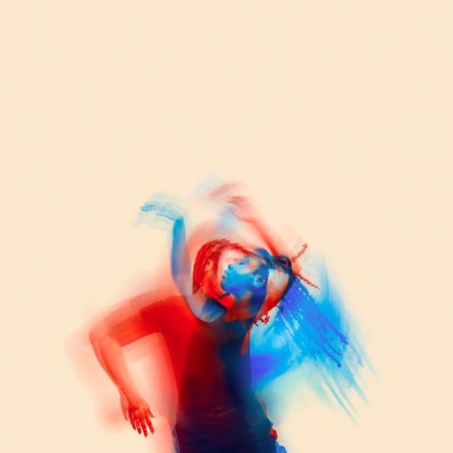Two figures dancing blurring into one image. One figure has a red filter, the other has a blue one.