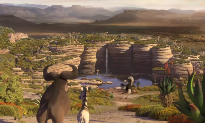 Animated animals at a watering hole, surrounded by rocks. Hills stretch out into the distance.