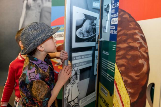 Two boys explore the M&S Archive exhibition 