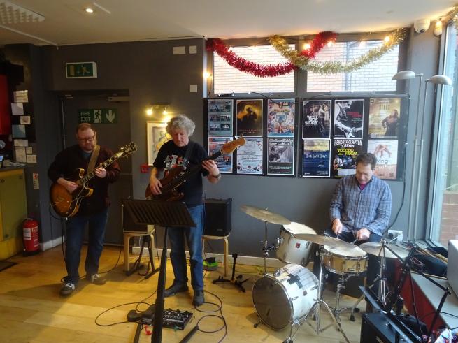 Musicians playing at Twixmas jam in Seven Bar