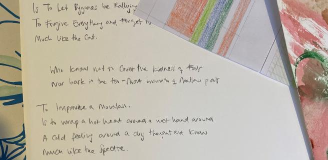 Handwritten words on a page with pattern sheets at its edges