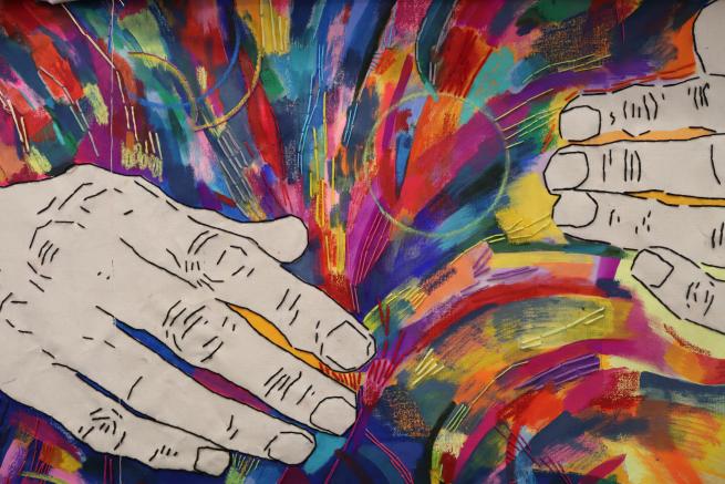 A colourful abstract painting with white embroidered hands