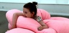 You person in the middle of a pink fluffy scultpure