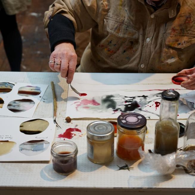 A student testing the inks made at the Ink making workshop