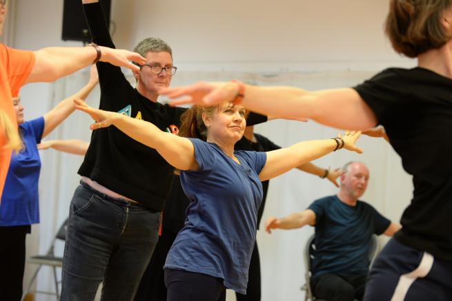Dancers reaching out