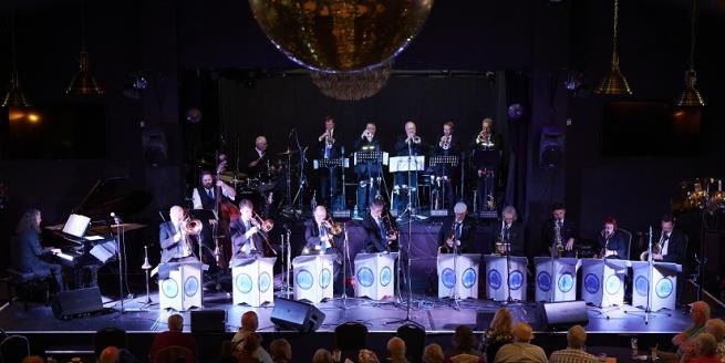 Pictuee of the Regeneration Big Band musicians in concert 
