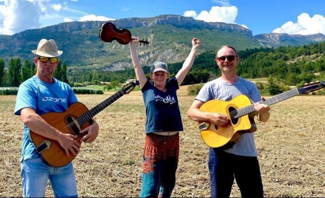 Boba swing trio playing in a field 