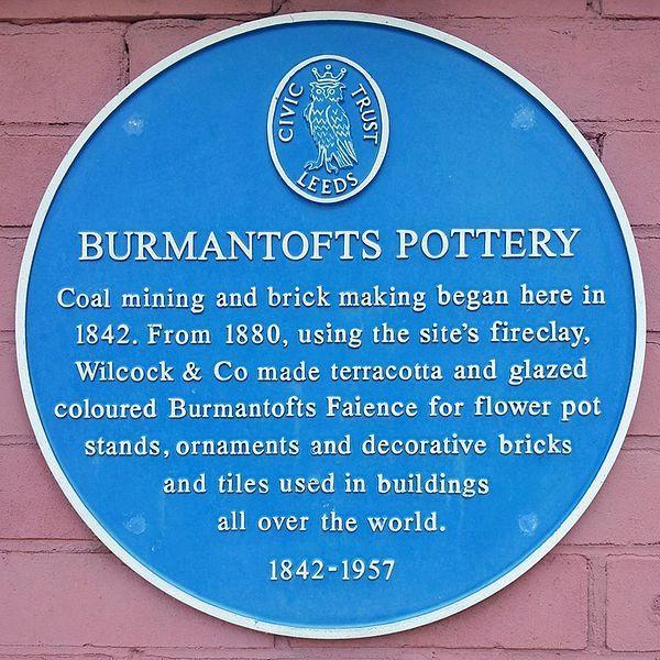 Blue Plaque displaying Burmantofts Pottery