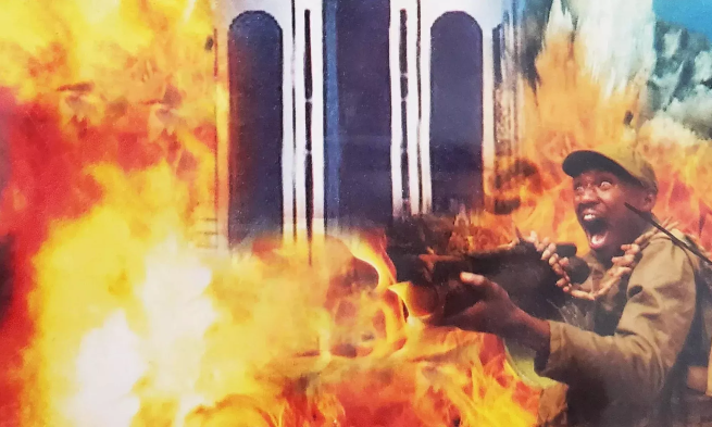 Man dressed in army attire shooting and screaming with fire surrounding him