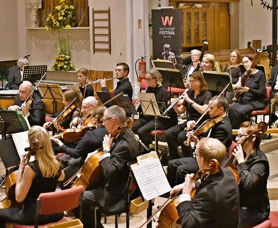 Photo players in orchestra