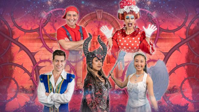 The panto cast pose in front of an orange and pink background, overgrown with thorns.