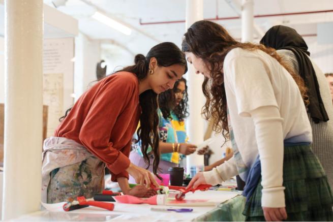 Photograph of two girls painting
