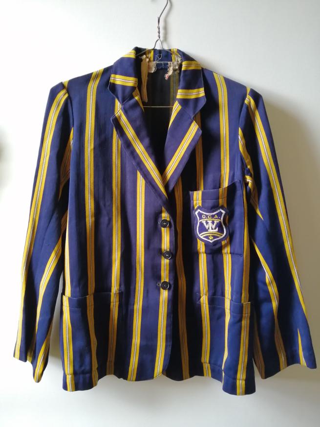 A yellow and blue striped school blazer